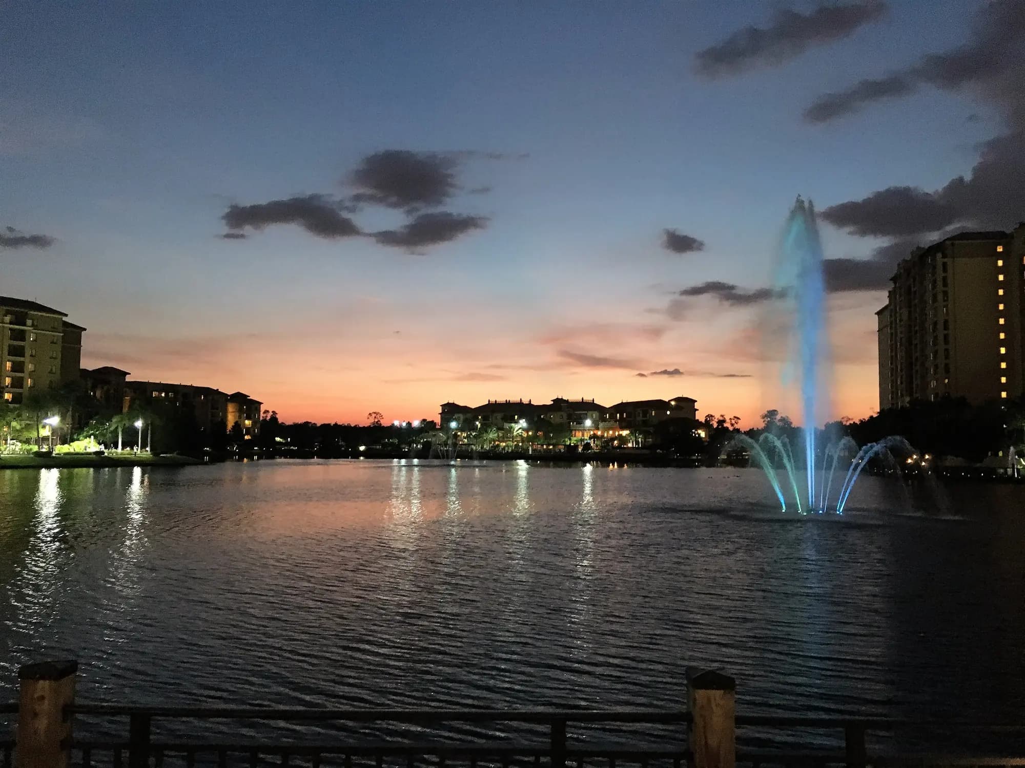 Resort lake with a fountain at dusk in Lake Buena Vista